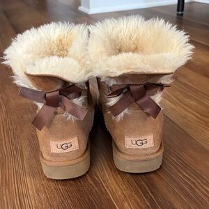 UGG Chestnut Sheepskin Mini Boots with Cream Fur and Brown Ribbon